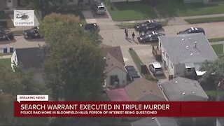 Search warrant executed in triple murder