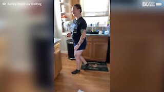 Over-protective cat won't let woman near dishes