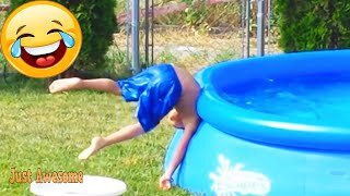 Funny Babies happily playing with water pools