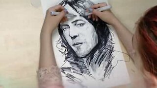 Artist draws with both hands simultaneously!