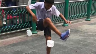 Kid shows off soccer skills ... with roll of toilet paper!