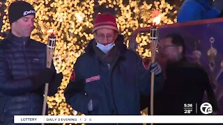 Danny Fenster honored in Detroit lighting the first Menorah in the D candle