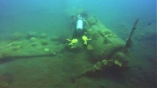 Scuba diver explores mysterious WWII fighter plane wreck