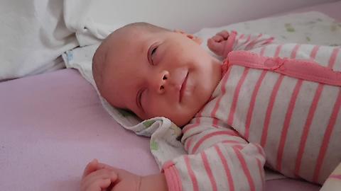 Sleeping Newborn Baby Smiles for the First Time!