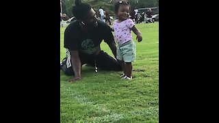 Baby girl walks to her dad for hugs & kisses