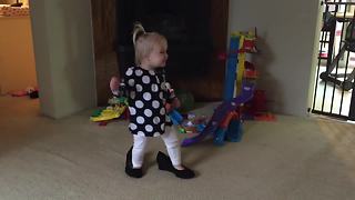 Little Girl Walks Around In Mommy's Shoes