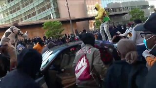 Eyewitness: Women drove car through protesters before being assaulted