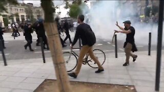 French Police Fire Tear Gas At Protestors Against A COVID Health Pass