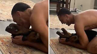 Rottweiler makes hilarious sounds after getting kissed
