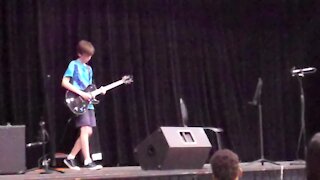 11-year-old totally shreds 'Paradise City' solo on his school stage