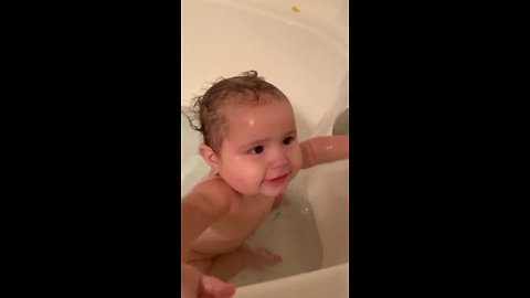 Adorable Baby Girl Tries to Catch Water