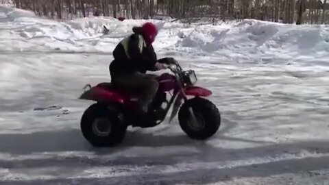 Guy performs amazing side spin trick on 3-wheeler
