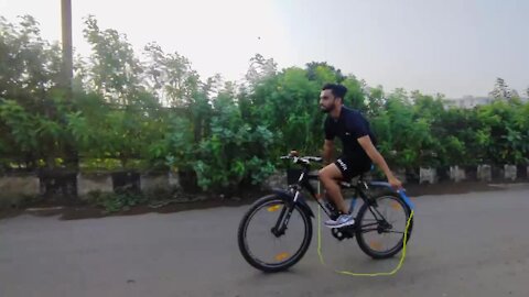 Guy can skip rope while riding a bike
