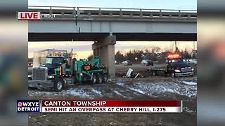 Semi truck hits overpass in Canton Township