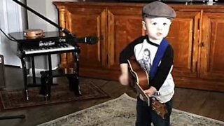 Adorable little boy loves country music
