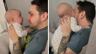 Teething baby literally tries to eat daddy's nose