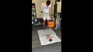 Baby girl helps motivate daddy to do his workout