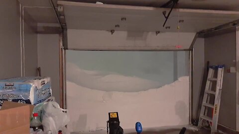 Garage Door Opening Dramatically Reveals Blizzard Outside