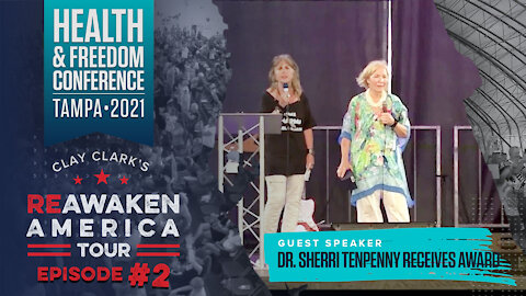Dr. Sherri Tenpenny receives award at General Flynn & Clay Clark's Reawaken America Tour