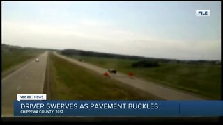 Video shows driver swerving after hitting buckled pavement