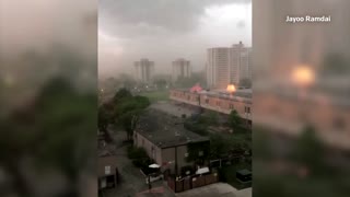 Trampoline flies between cars during storm in Toronto