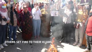 Women in Kurdish Syria cut hair and burn headscarves in solidarity over Mahsa Amini's death