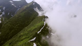 Drone Flying Over The Mountain Peak