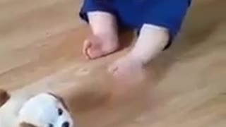 adorable baby laughing with the dog