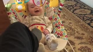 Giggling baby can't stop laughing with babysitter
