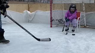 Frustrated goalie throws her stick when dad scores on her
