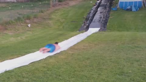 Man Develops High Speed And Goes Flying Off The Slip And Slide Set