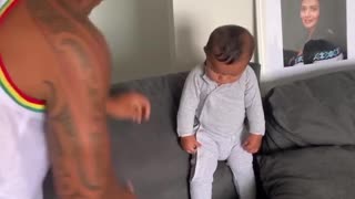 Father and Infant Son Perform a Mauri Haka Together