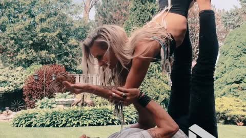 Acro yoga whilst feeding a chipmunk