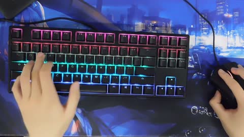 A gamer playing on his RGB setup