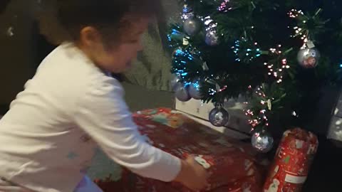 My daughter very happy opening her Christmas presents