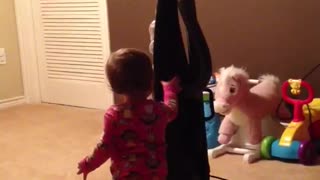 Curious baby meets vacuum cleaner, instantly gets scared