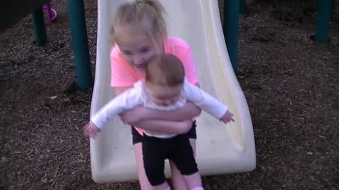 Big Sister takes Little Sister down the Slide