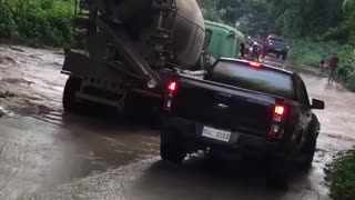 Truck Driver helping a pick up truck