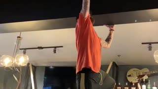 Manager Attempts to Remove Sticky Bra from Ceiling