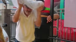 Burger King Employee Protecting Customers From the Rain