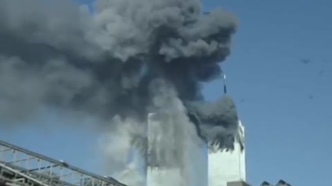 Tower explodes without a plane. Video from a passing car..