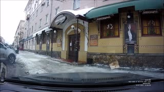 Person Walking on Sidewalk Has Close Call with Falling Snow