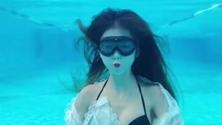 Beautiful girl dancing underwater