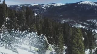 Skier backflips off ramp and lands on the front of skis