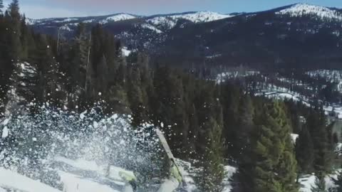 Skier backflips off ramp and lands on the front of skis