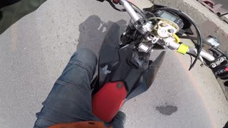 Motorcycle Rider Bumps into Surprise Barrier