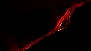 Metre-high lava shoots into night sky from Mount Etna