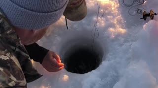 Man Makes Huge Catch while Ice Fishing