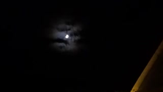 Freaky! The moon has clouds behind it?