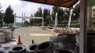 Guy in yellow shirt crashes go kart
